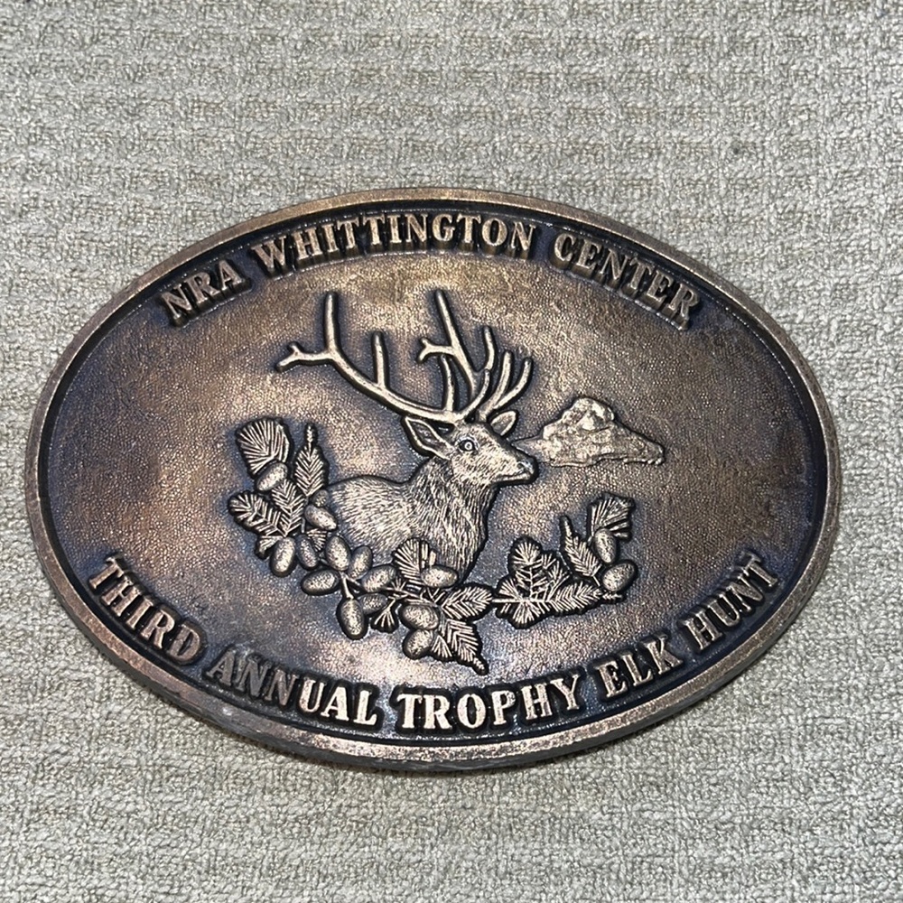 NRA WHITTINGTON CENTER THIRD ANNUAL TROPHY ELK HUNT belt buckle.